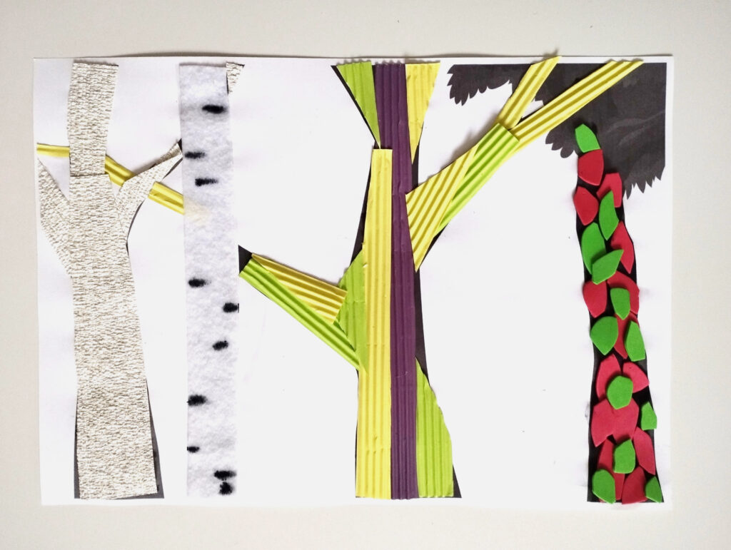 Obrazek z drzewami wyciętymi z różnego rodzaju papieru