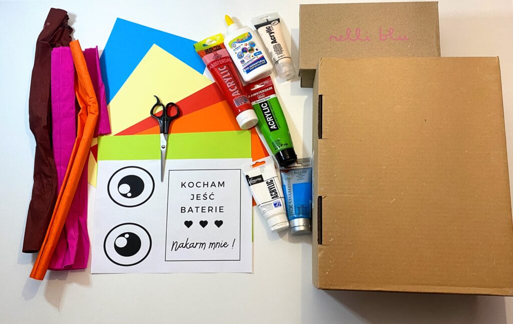 krepina, kolorowy papier, farby i pudełka potrzebne do wykonania zadania